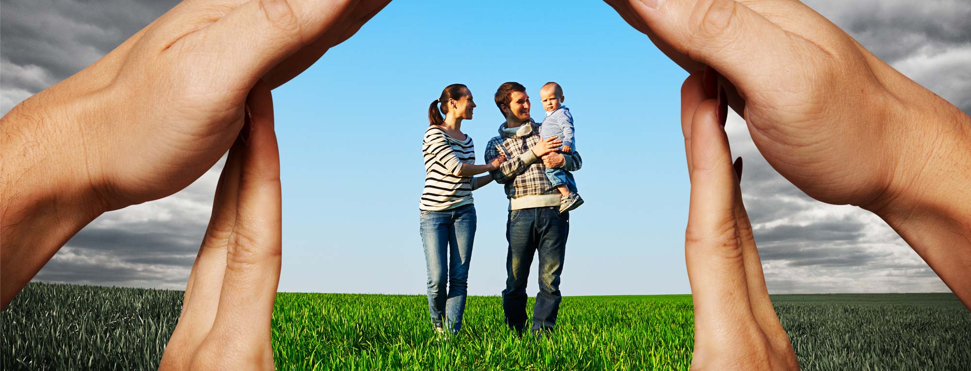 Family Standing in a Grass Field